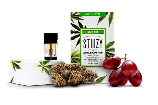Granddaddy Purple weed next to a Stiizy vape cartridge and fruit