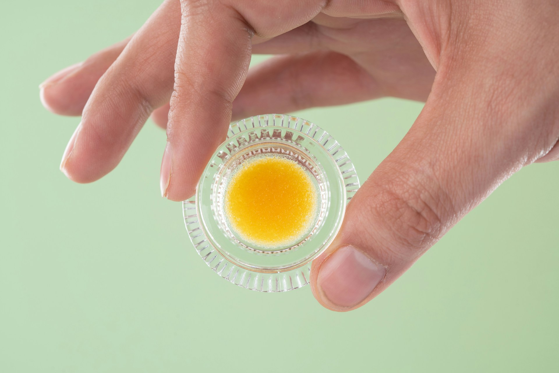 hand holding cannabis concentrate